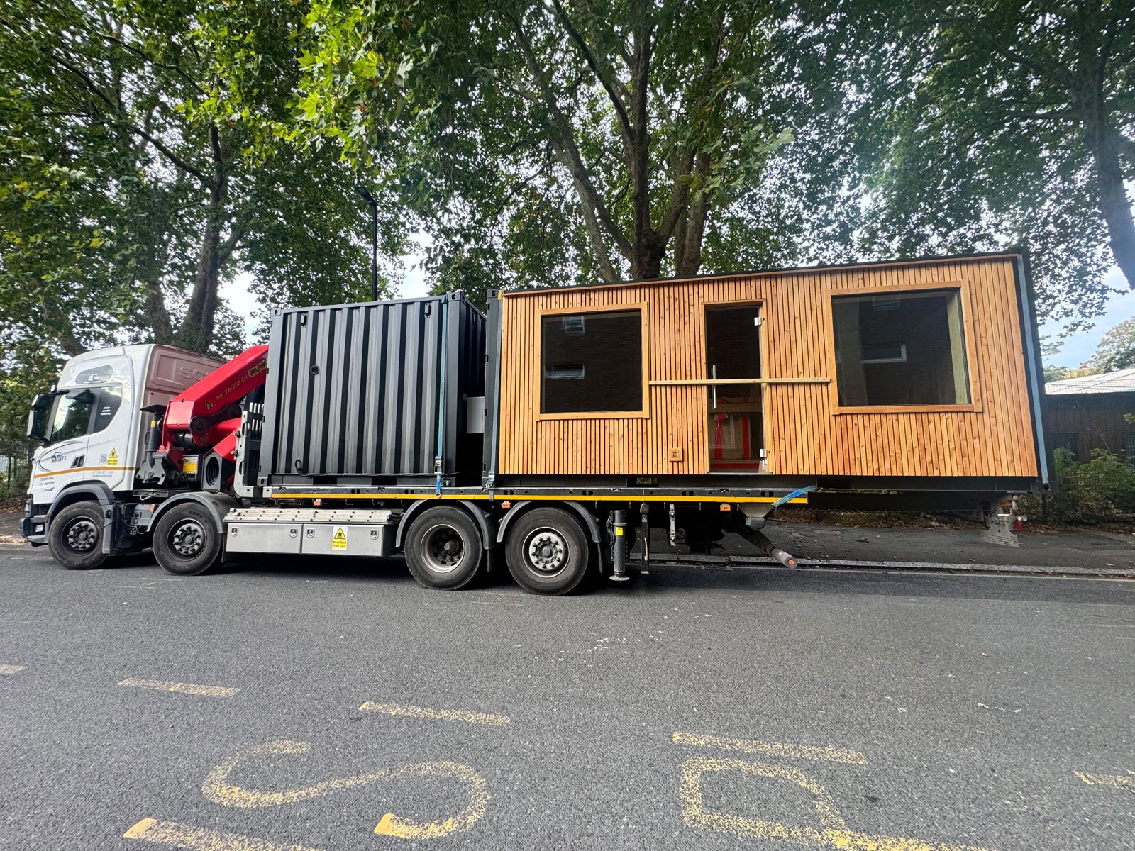 Lorry carrying a converted cabin unit